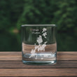 Load image into Gallery viewer, A clear glass with a white design on it, placed on a wooden surface.
