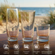 Load image into Gallery viewer, Three different-sized glass cups are displayed on a wooden surface, with a beach and ocean in the background.