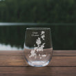 Load image into Gallery viewer, A clear glass with a white design on it, placed on a wooden surface.
